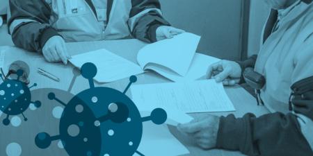 Man and woman at table with paperwork with disease graphic overlay