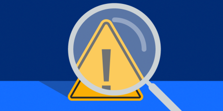 Hazard symbol in yellow triangle with magnifying glass over the top.
