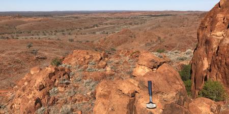 A rocky landscape with a tool in the foreground.