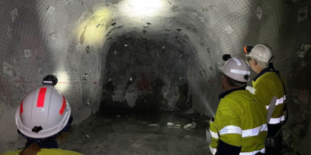 Inspectors viewing strata support in an underground mine