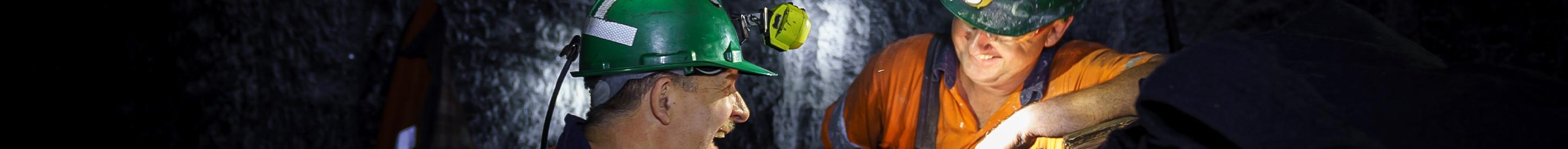 Underground mine workers laughing