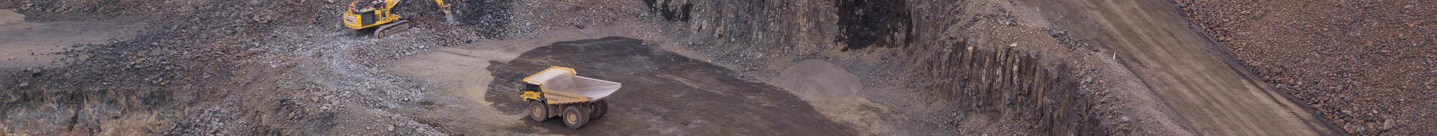 Digger and haul truck at mine site