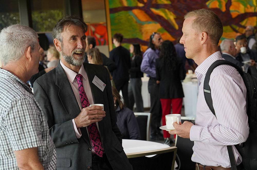 Exploration in the House 2025 attendees talking during a break
